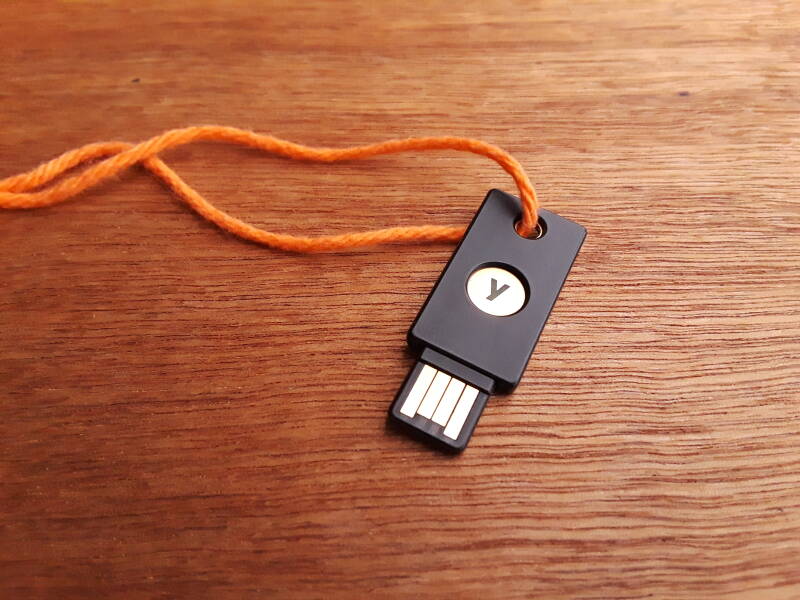 YubiKey used to authenticate to Linux using elliptic-curve cryptography.