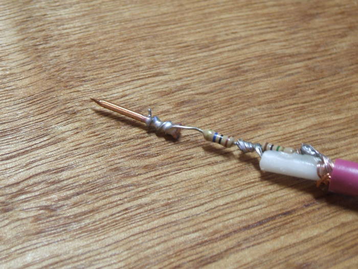 How to build your own oscilloscope probes: Using a nail for a probe tip.