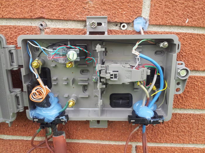 Network interface box on rear of house..