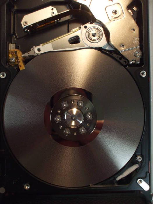 iOmega external disk, cover removed and platters and heads and arms exposed.