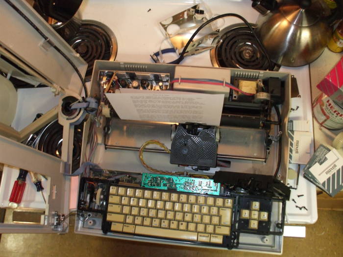 Smith-Corona Personal Word Processor or PWP, partially disassembled, sitting on a stove.