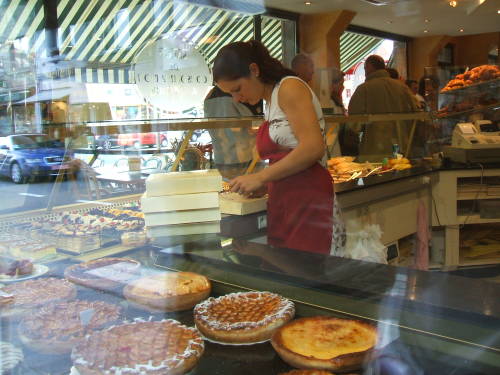 The hot Belgian waffle maker.  A girl making pastry in Houffalize, Belgium.