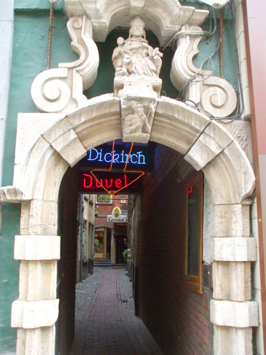 Narrow passageway leading to the Au Bon Vieux Temps cafe in Brussels.