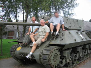 Three guys on a tank.