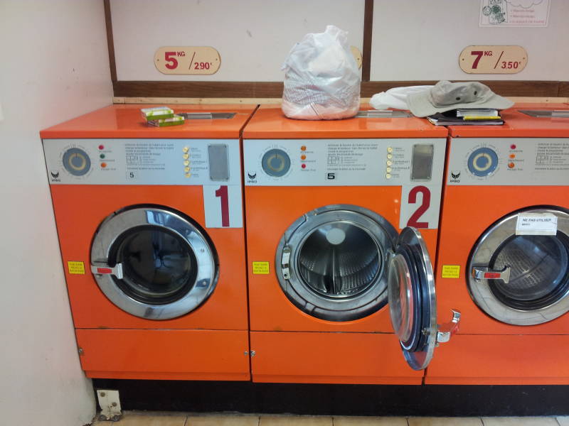 Washing machines in a lavomat or laverie in Avignon.