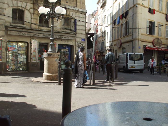 Watching the crowds pass while seated at le Grand Bar Vacon in the market district of Marseille.