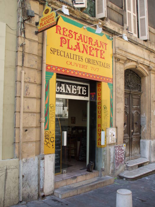 Small businesses along Rue des Petites Maries in Marseille.