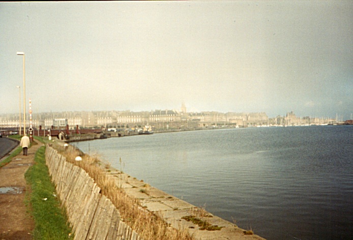 I walk along the harbor jetty into Saint Malo early in the morning.