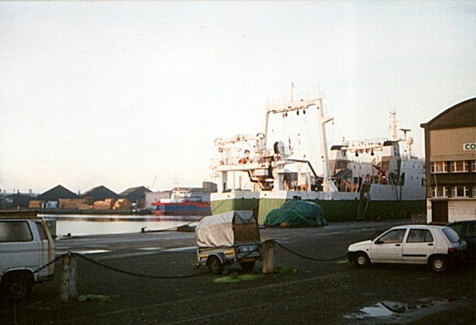 I look across the quay and a fishing ship in the harbor from the Cap-Malo restaurant, bar, and hotel in Saint Malo, France.