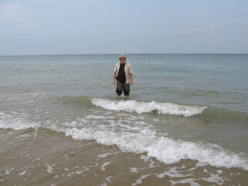 Bob standing a little over knee deep on Omaha Beach at Saint-Laurent-sur-Mer.