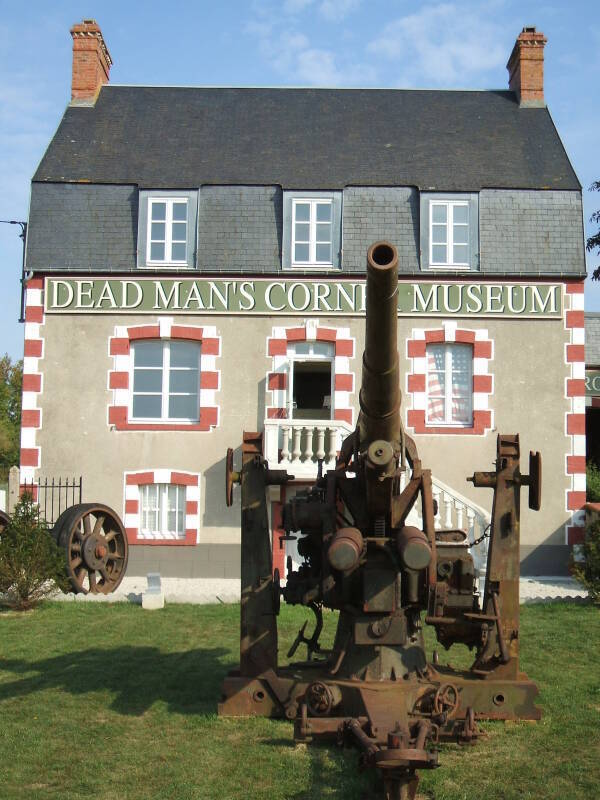 An old stone inn turned into a museum at Dead Man's Corner, in Normandy, near the D-Day landing sites at Utah Beach. A rusting old German 88mm gun in the foreground.