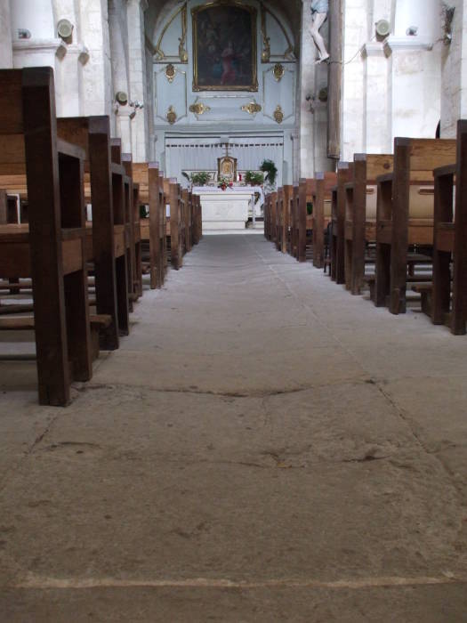 Worn floor in the nave of the Church of Saint Michael in Roussillon.