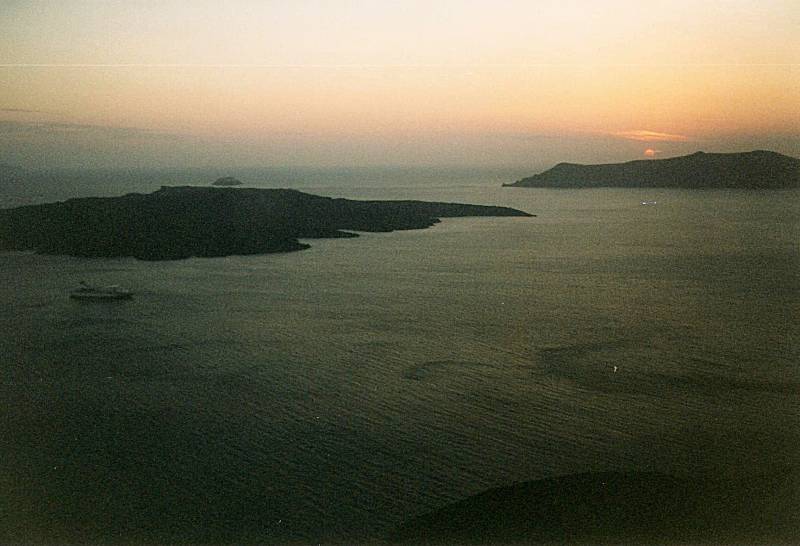 Sunset over Santorini as seen from a taverna.