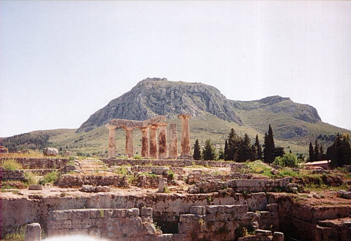 Akrokorinthos rises behind the Temple of Apollo in Corinth.