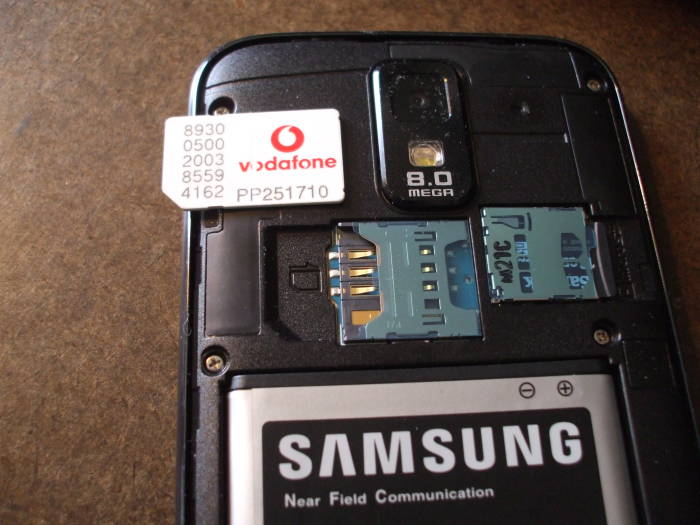 Replacing a SIM card in a mobile phone.