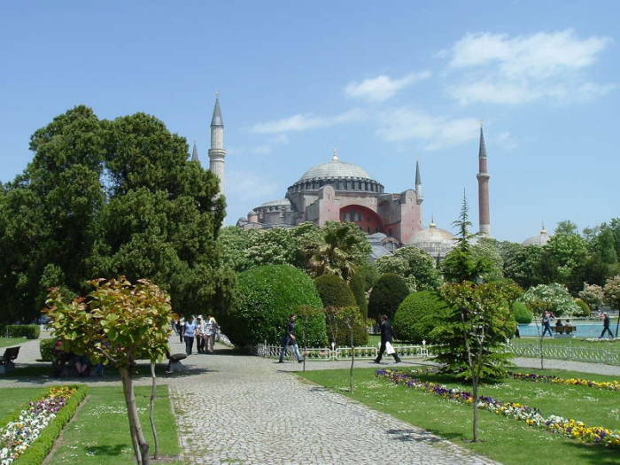 Exterior of the Hagia Sophia or Aya Sofya, in Istanbul. Four large minarets around a large dome.