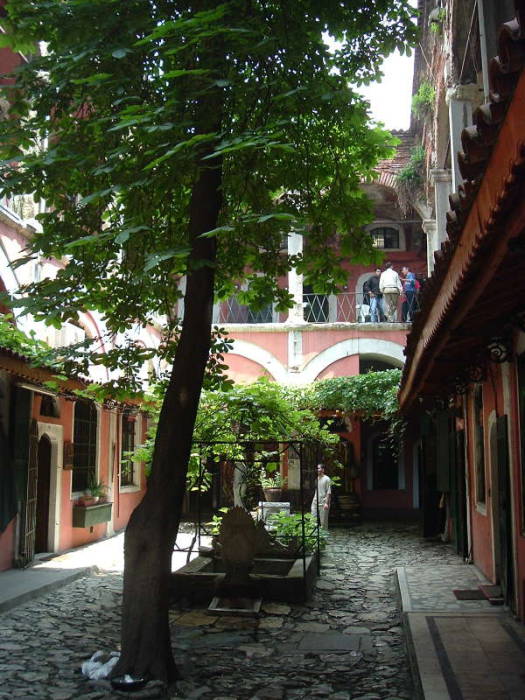 Zincirli Han within the Grand Bazaar in Istanbul.  Shops and offices around a small courtyard, balconies above.  According to 'From Russia With Love', a KGB office was up on that balcony.