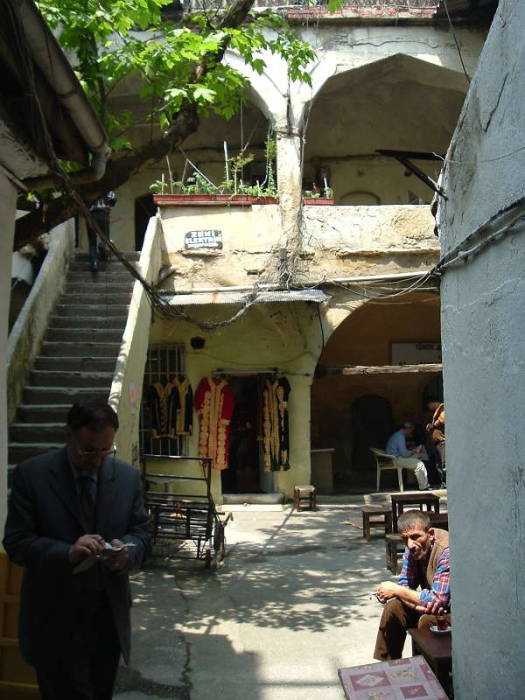 Büyük Safran Han within the Grand Bazaar in Istanbul. Stairs leading up to a balcony.