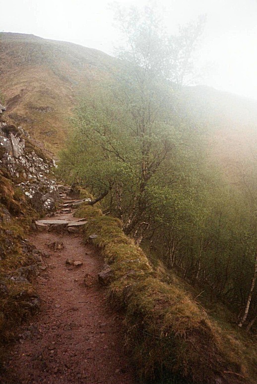 In the rain ascending Ben Nevis, in Scotland.