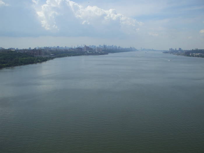 View down the Hudson River from the pedestrian walkway on the George Washington Bridge, Jersey City at right and Midtown and Lower Manhattan at right.
