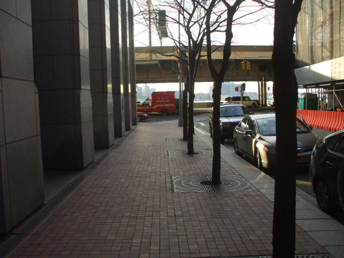 Old Slip Park, beside the NYPD Museum, approaching South Street and the East River Drive.