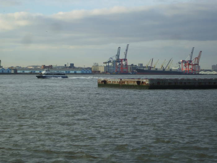 View across East River to Brooklyn waterfront, looking over the end of the Downtown Manhattan Heliport.