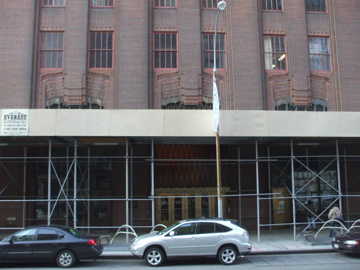 Ornate brickwork surrounds and windows and entryways of 60 Hudson Street.