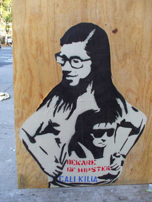 Stencil art of a hipster girl wearing a T-shirt bearing stencil art. BEWARE OF HIPSTERS!