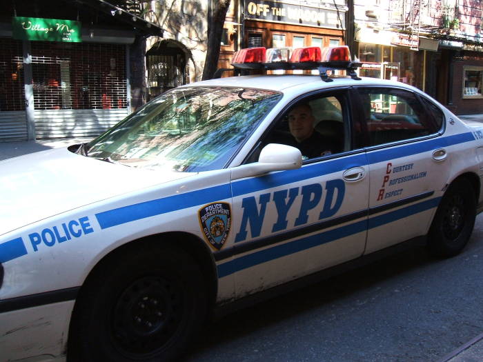 NYPD patrol car on MacDougal Street in Greenwich Village.