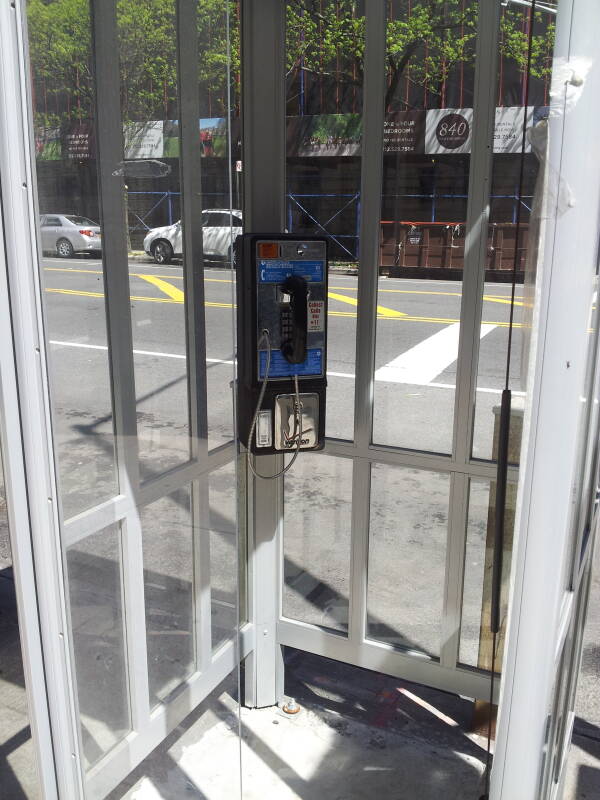 'Superman-style' full-height phone booth, one of the last 4 in Manhattan, at West End Avenue and 101st Street.