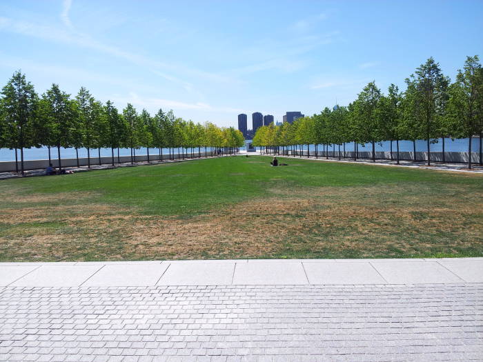 Open grass plaza at Franklin D. Roosevelt Four Freedoms Park on Roosevelt Island in the East River in New York.